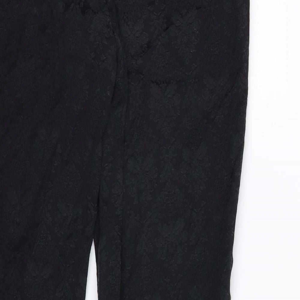 Brand and care label for Zara women’s black floral trousers, size L, 26-inch leg