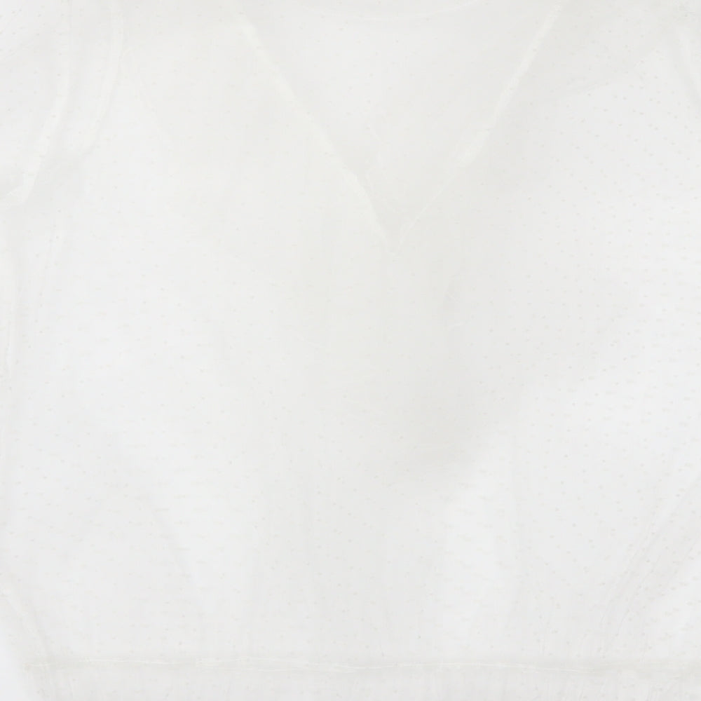 Brand and care label for Primark women’s white polka dot basic blouse, size UK 12