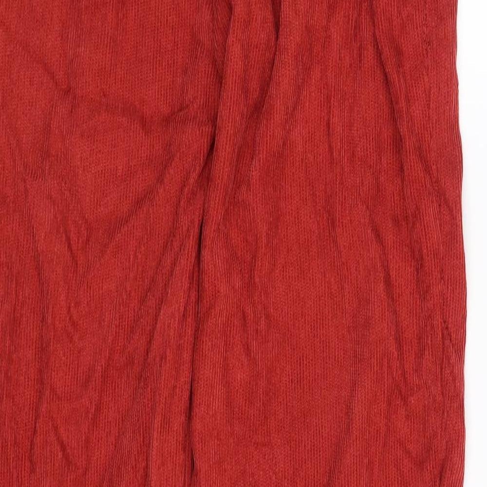 Brand and care label for SHEIN women’s red trousers, size S, 29-inch leg