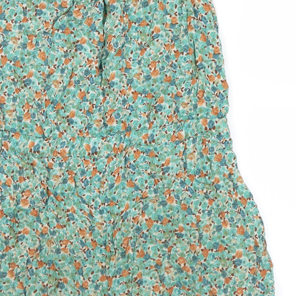 Brand and care label for Zara women’s green floral shorts one-piece, size S