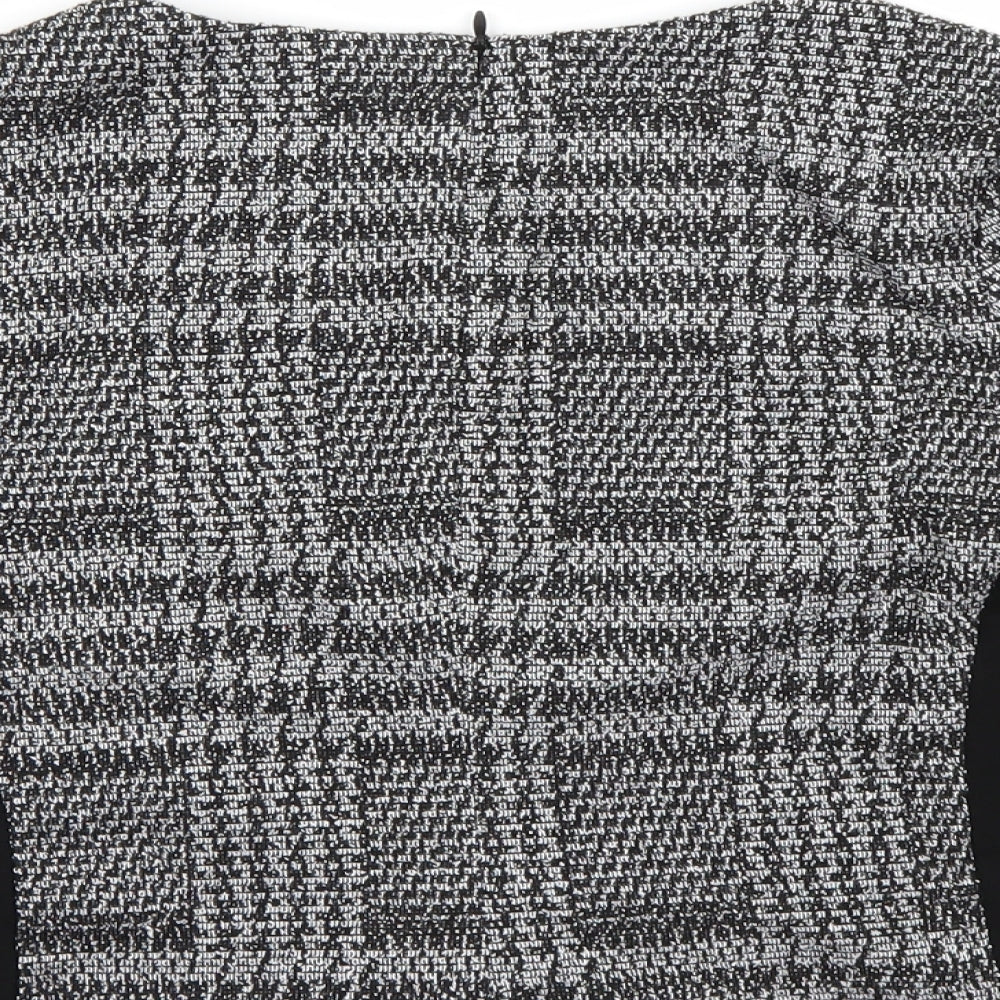 Brand and care label for Eliane Rose women’s black check basic blouse, size S