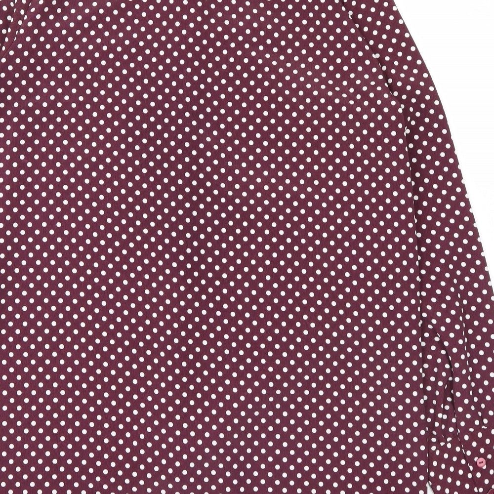 Brand and care label for Primark women’s purple polka dot basic button-up, size UK 12