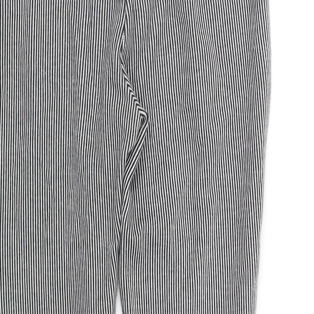 Brand and care label for Zara women’s black striped jegging trousers, size S, 32-inch leg