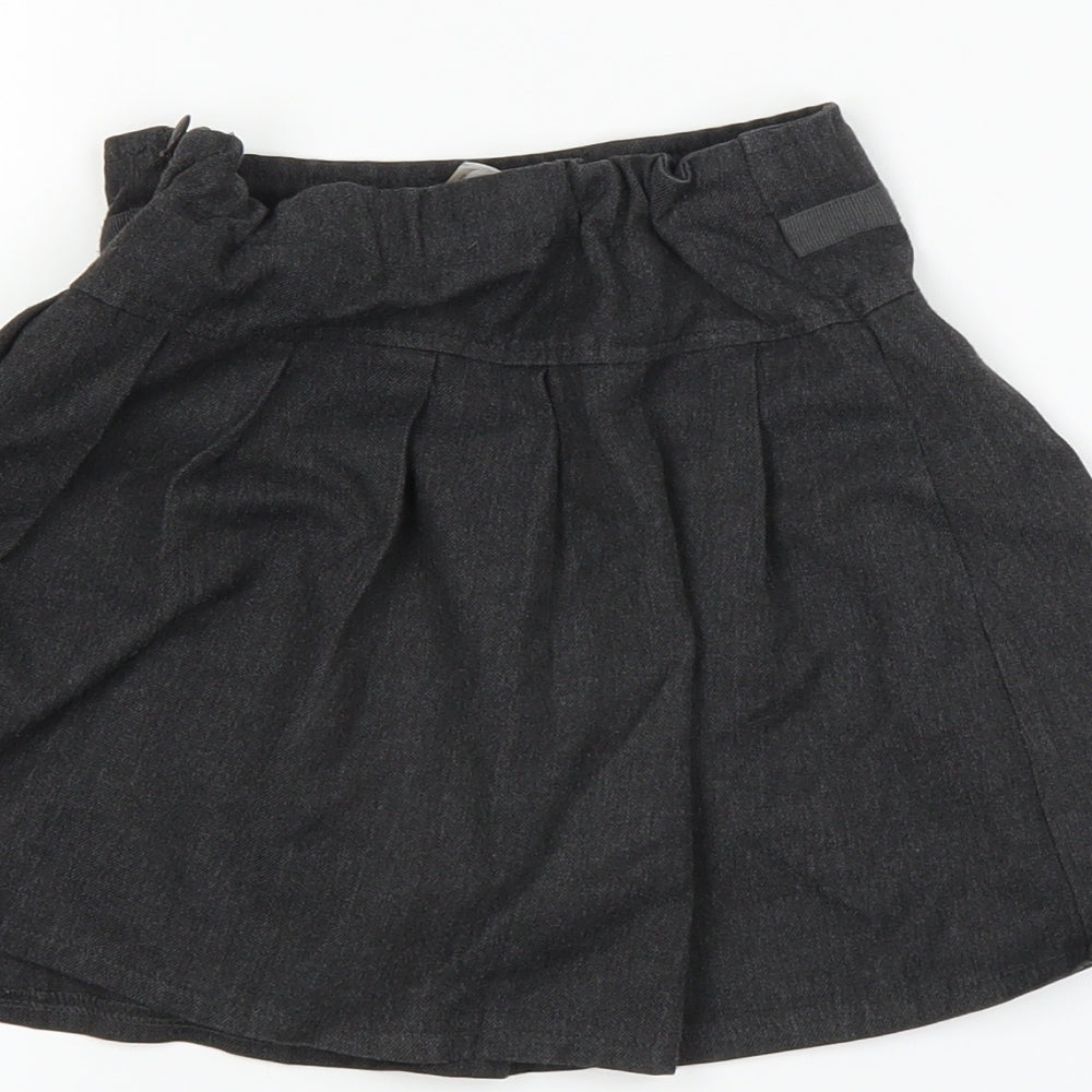 Brand and care label for Tu girls’ grey pleated skirt, size 4, years