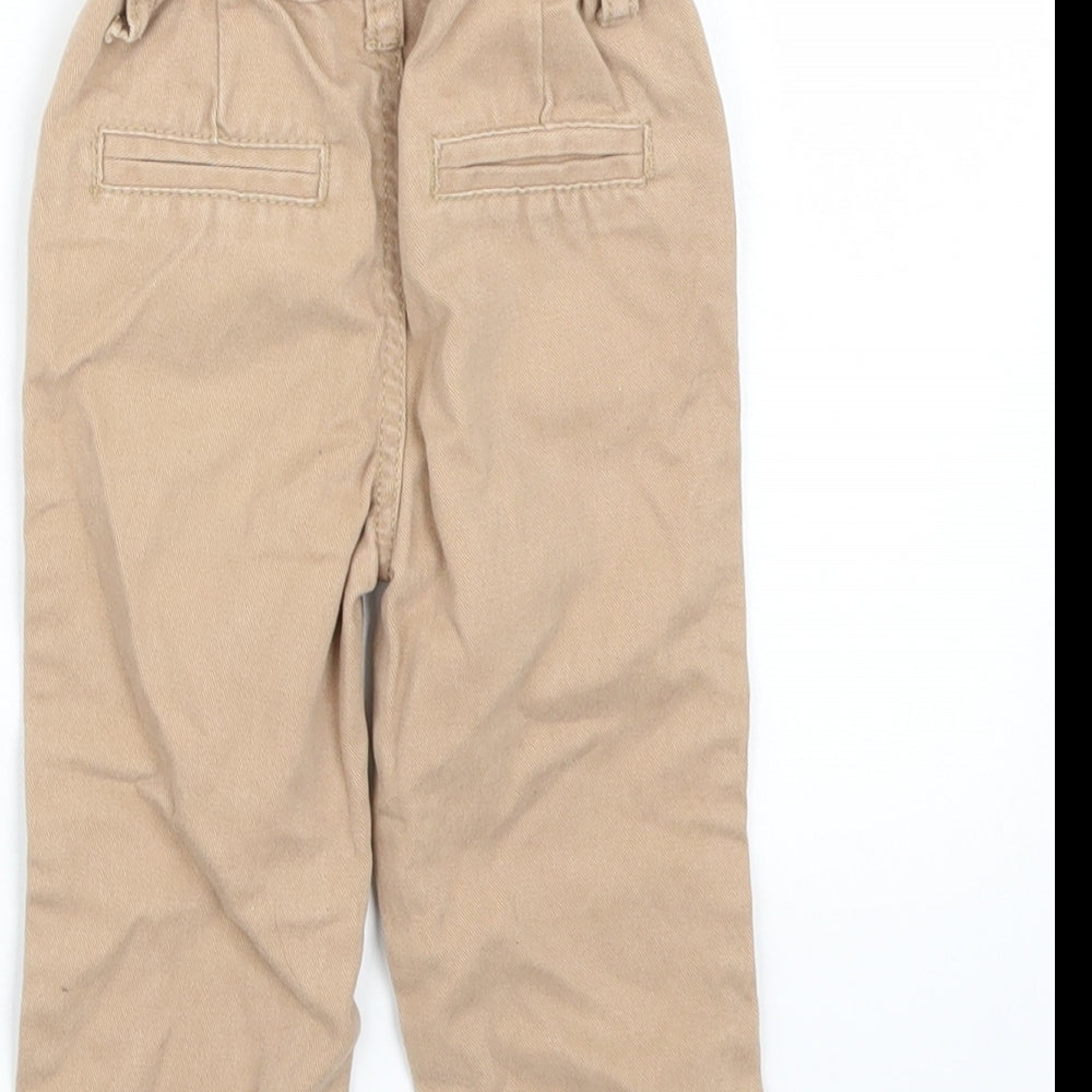 Brand and care label for Denim & Co. girls’ brown capri jeans, size 9-12, months