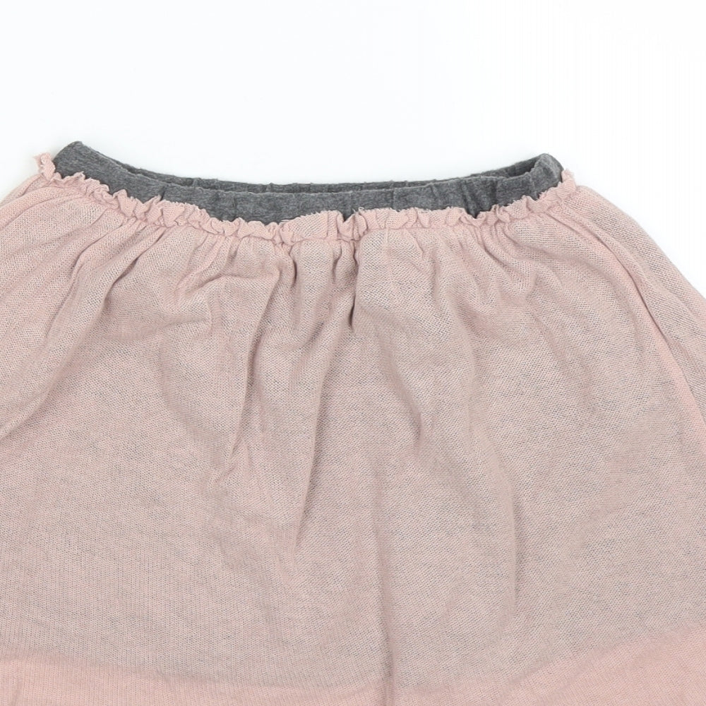 Brand and care label for Mango girls’ pink a-line skirt, size M