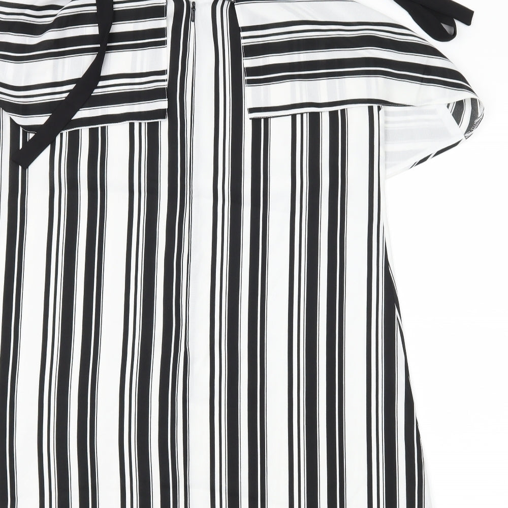Brand and care label for Miss Selfridge women’s black striped shift, size UK 12
