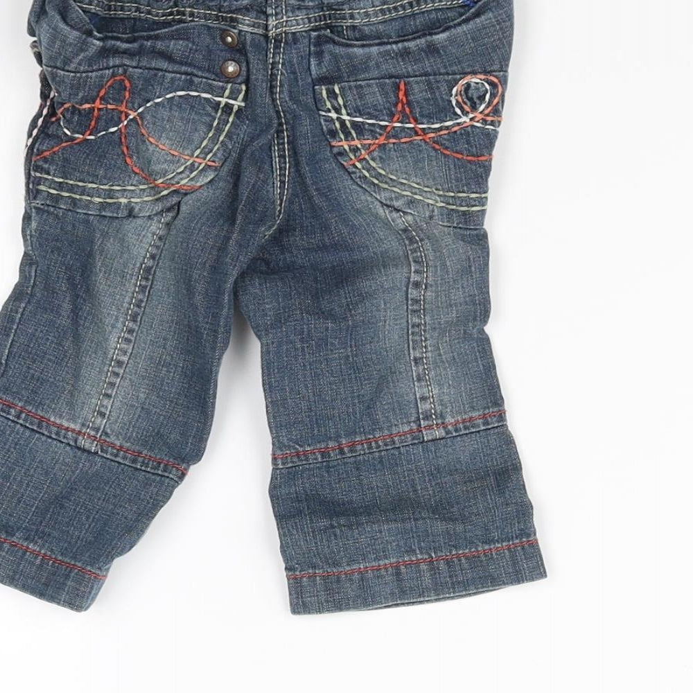 Brand and care label for Next girls’ blue capri jeans, size 6-9, months
