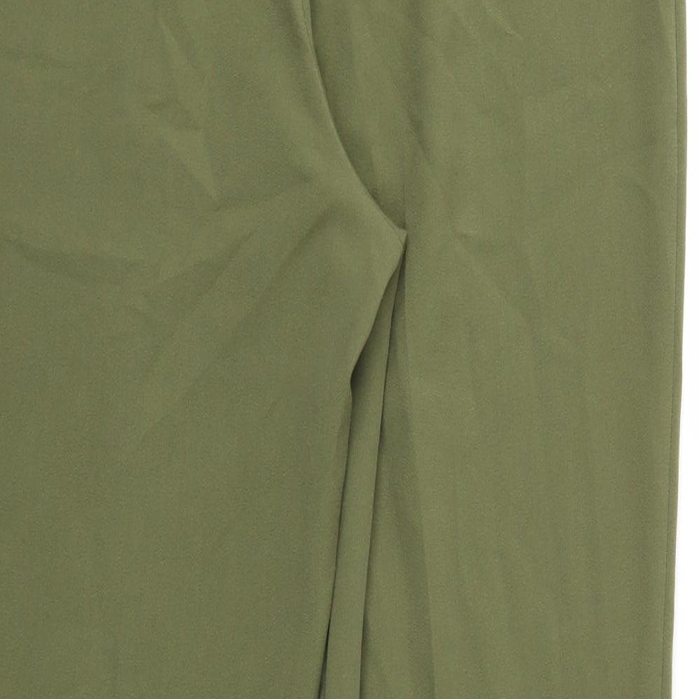 Brand and care label for Classics women’s green trousers, size UK 32, in, 27-inch leg