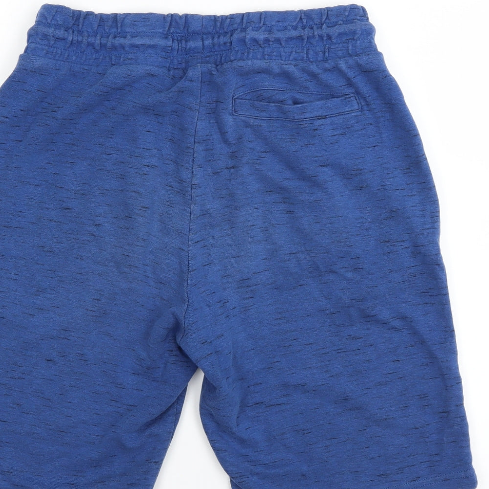 Brand and care label for F&F boys’ blue sweat shorts, size S