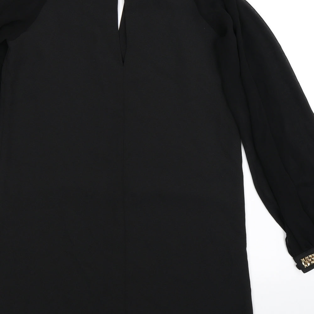 Brand and care label for Miss Selfridge women’s black mini, size UK 10