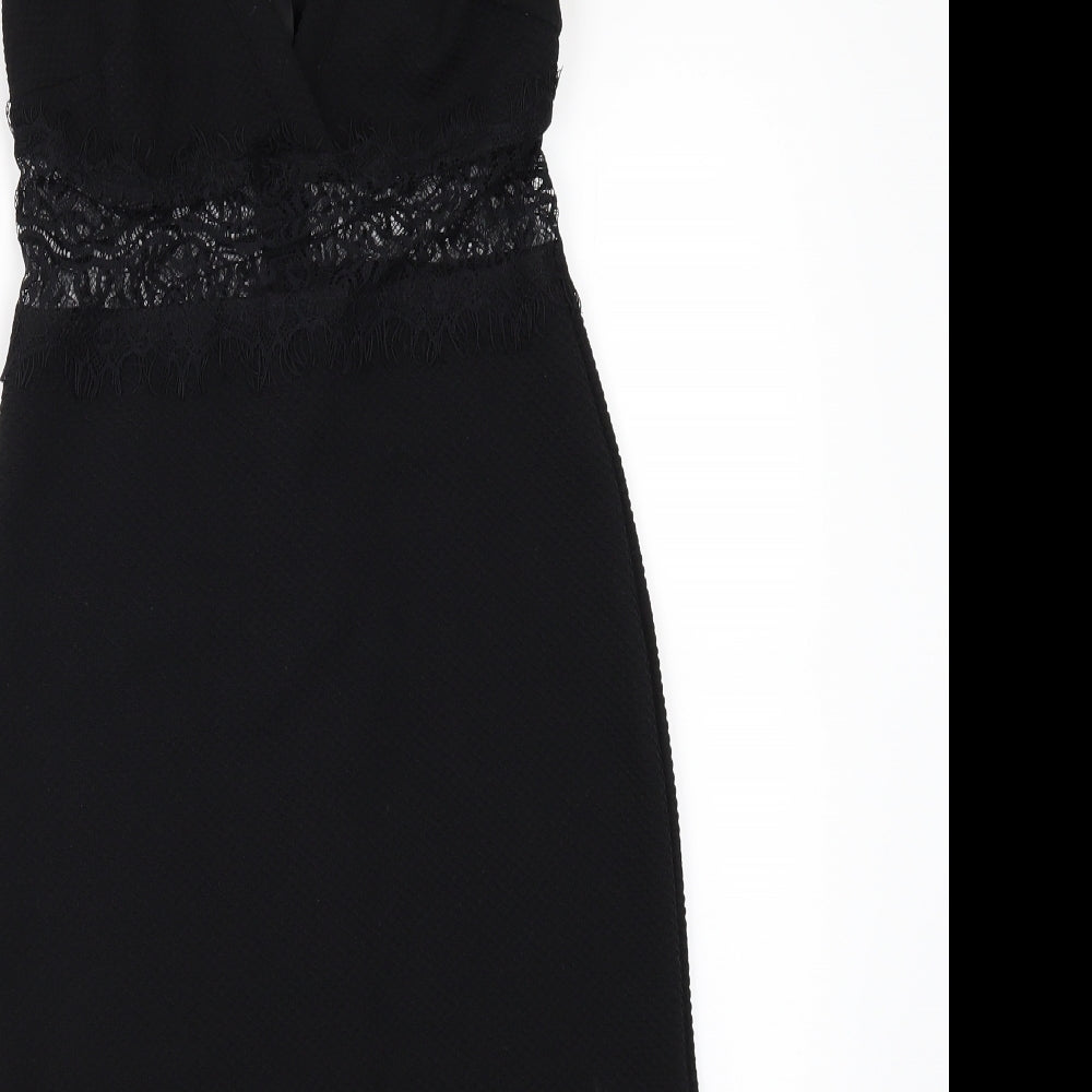 Brand and care label for Miss Selfridge women’s black mini, size UK 8