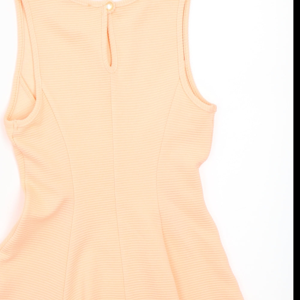 Brand and care label for Primark women’s orange basic t-shirt, size UK 6