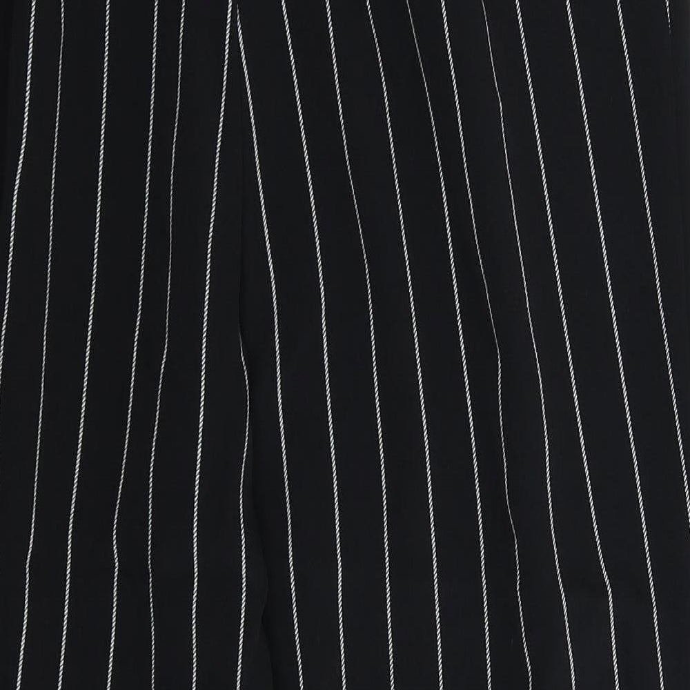 Brand and care label for Divided women’s black striped trousers, size UK 10, 25-inch leg