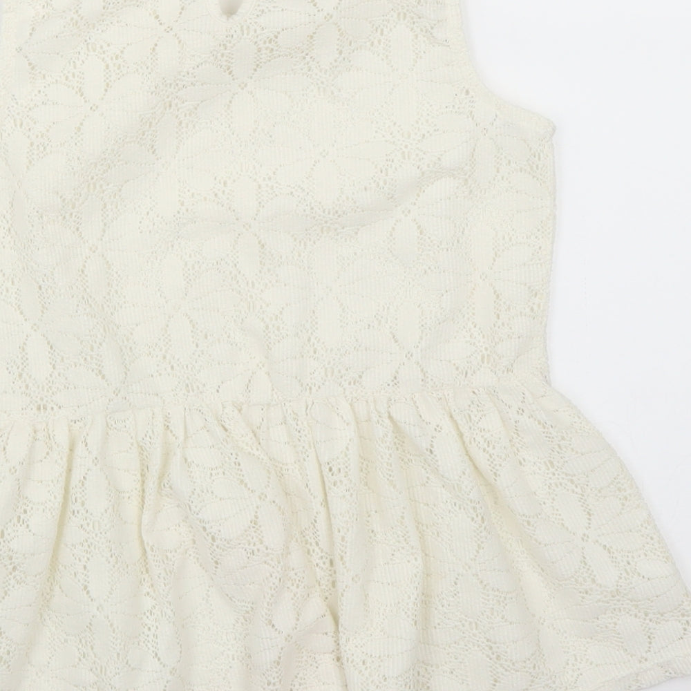 Brand and care label for George girls’ ivory basic blouse, size 8-9, years