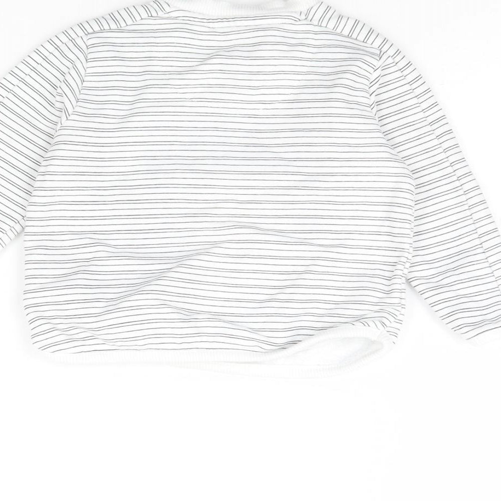 Brand and care label for F&F girls’ white striped rayon jumper, size 3-6, months