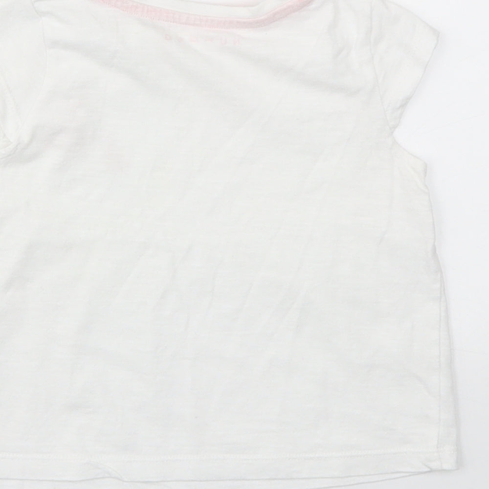 Brand and care label for Nutmeg girls’ white basic t-shirt, size 12-18, months