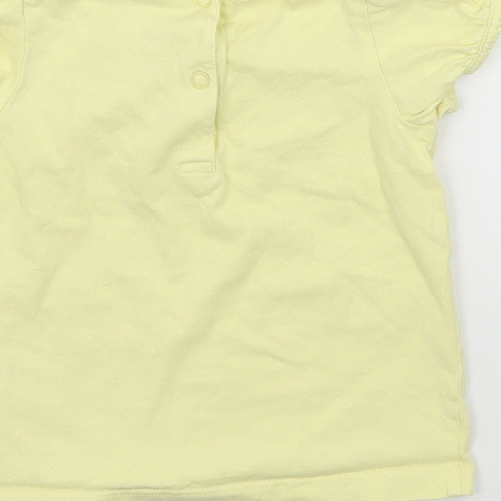 Brand and care label for H&M girls’ yellow polka dot jersey basic t-shirt, size 12-18, months
