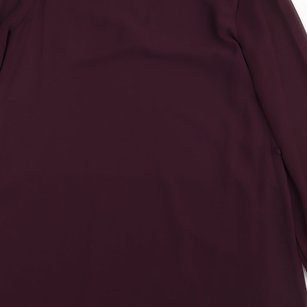 Brand and care label for Atmosphere women’s purple basic blouse, size UK 10