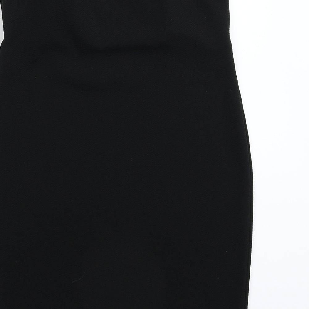 Brand and care label for Missguided women’s black mini, size UK 10