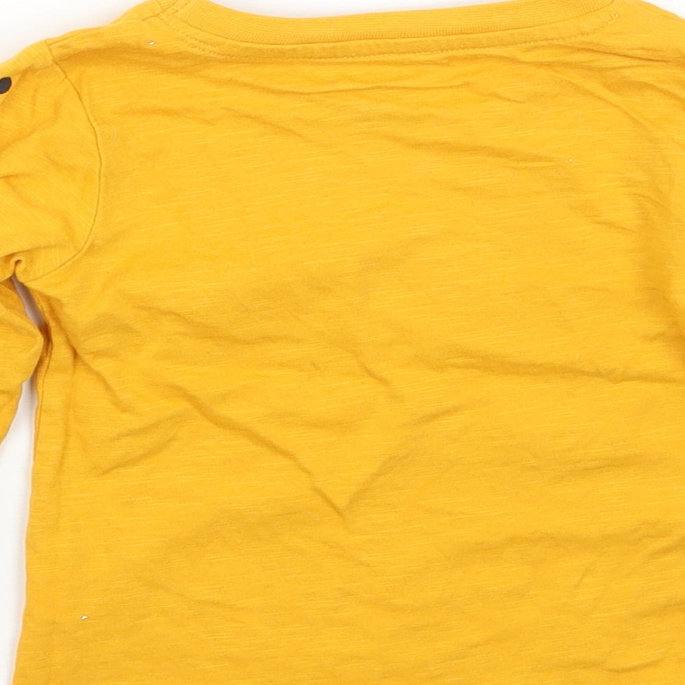 Brand and care label for Primark girls’ yellow basic t-shirt, size 12, months