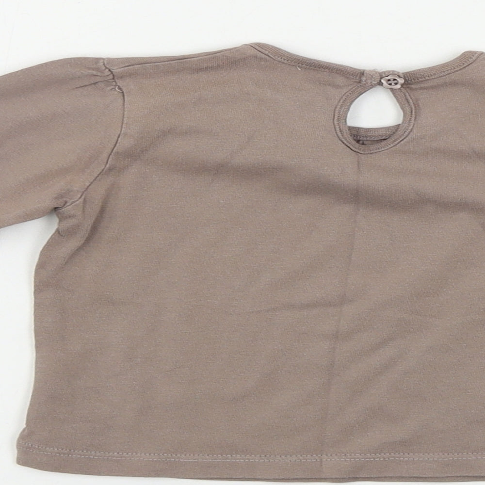 Brand and care label for Cherokee girls’ brown basic t-shirt, size 12-18, months