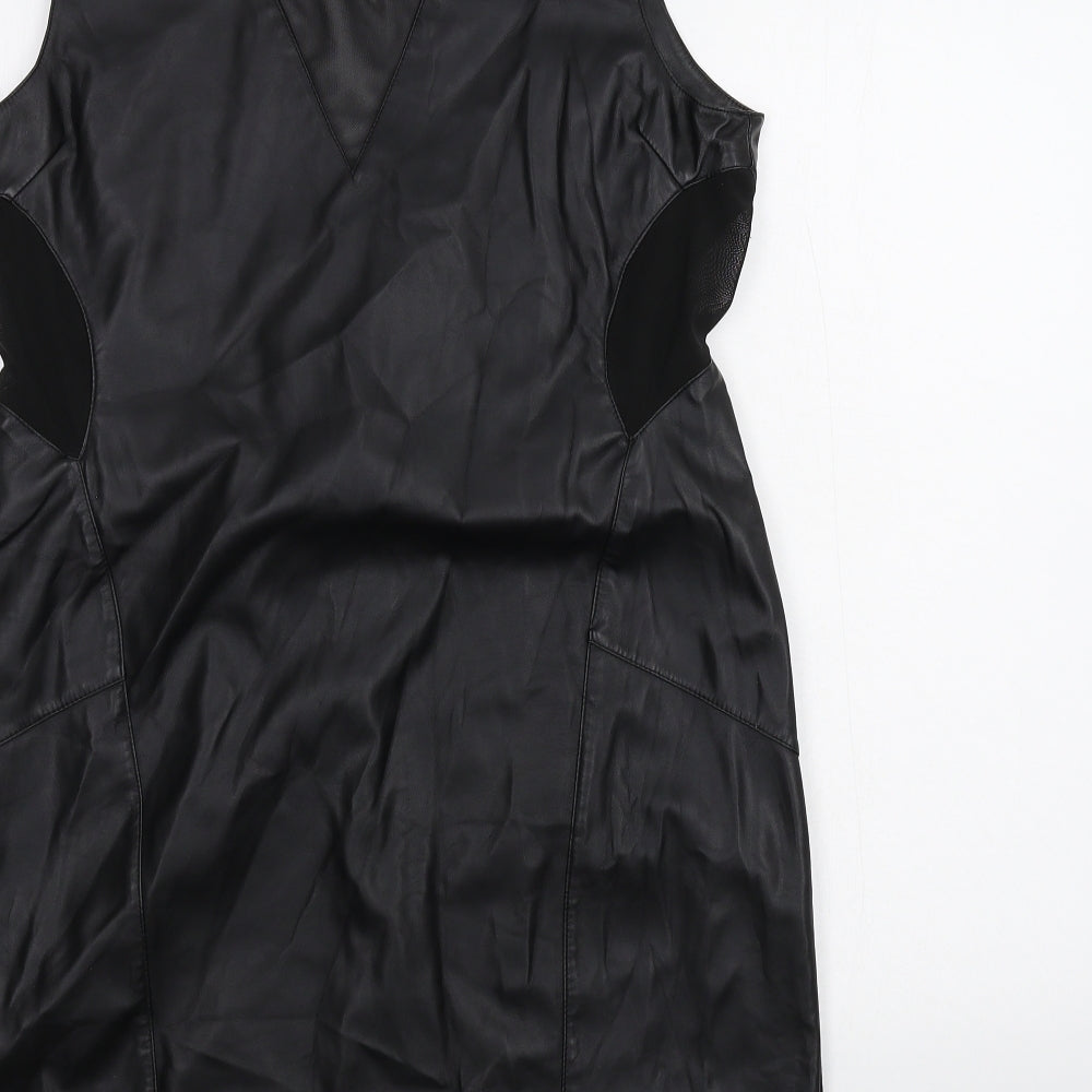 Brand and care label for Miss Selfridge women’s black a-line, size UK 16