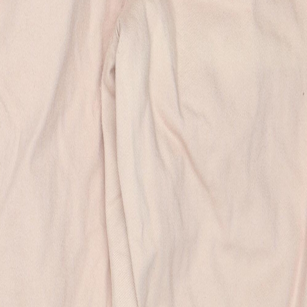 Brand and care label for Missguided women’s beige cotton mom jeans, size UK 12, regular zip