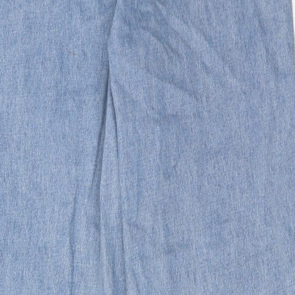 Brand and care label for Missguided women’s blue cotton mom jeans, size UK 6, regular zip