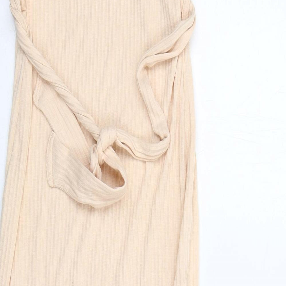 Brand and care label for Missguided women’s beige polyester tank dress, size UK 10, v-neck pullover
