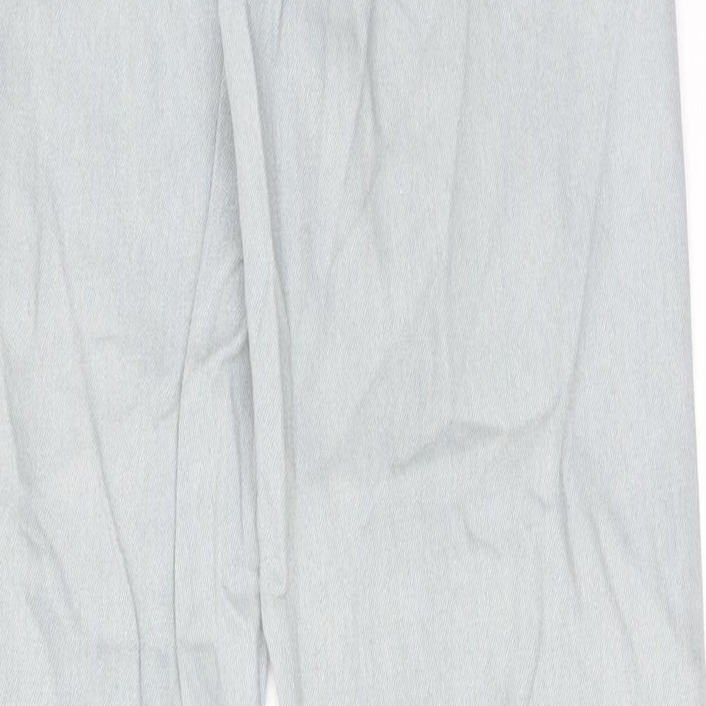 Brand and care label for Missguided women’s blue cotton tapered jeans, size UK 8, regular zip