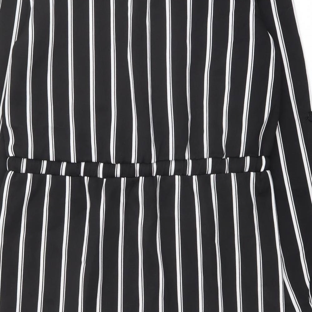 Brand and care label for Missguided women’s black striped polyester shirt dress, size UK 8, collared button