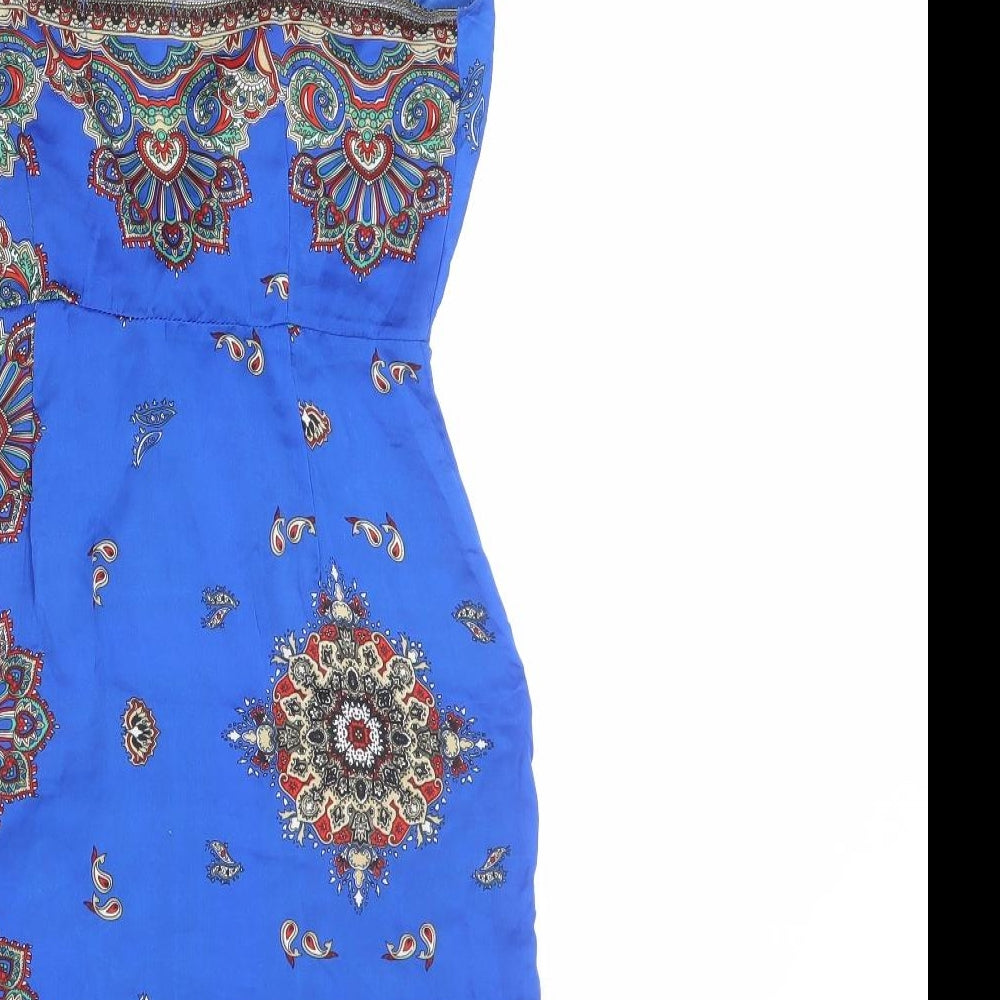 Brand and care label for Missguided women’s blue geometric polyester mini, size UK 6, v-neck zip