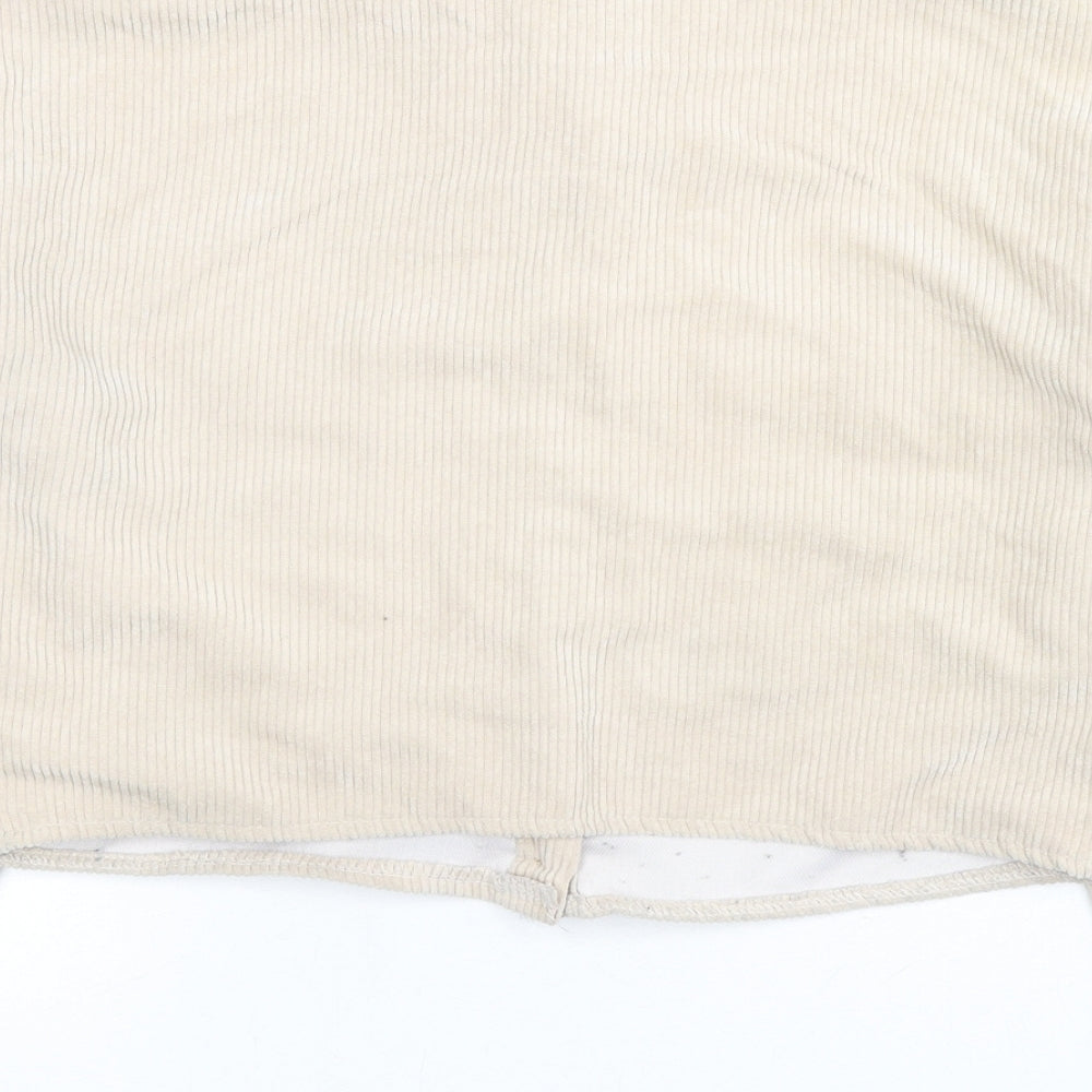 Brand and care label for Missguided women’s beige jacket, size UK 6, button