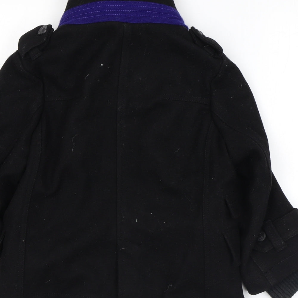 Brand and care label for Baker girls’ black overcoat coat, size 6, years zip