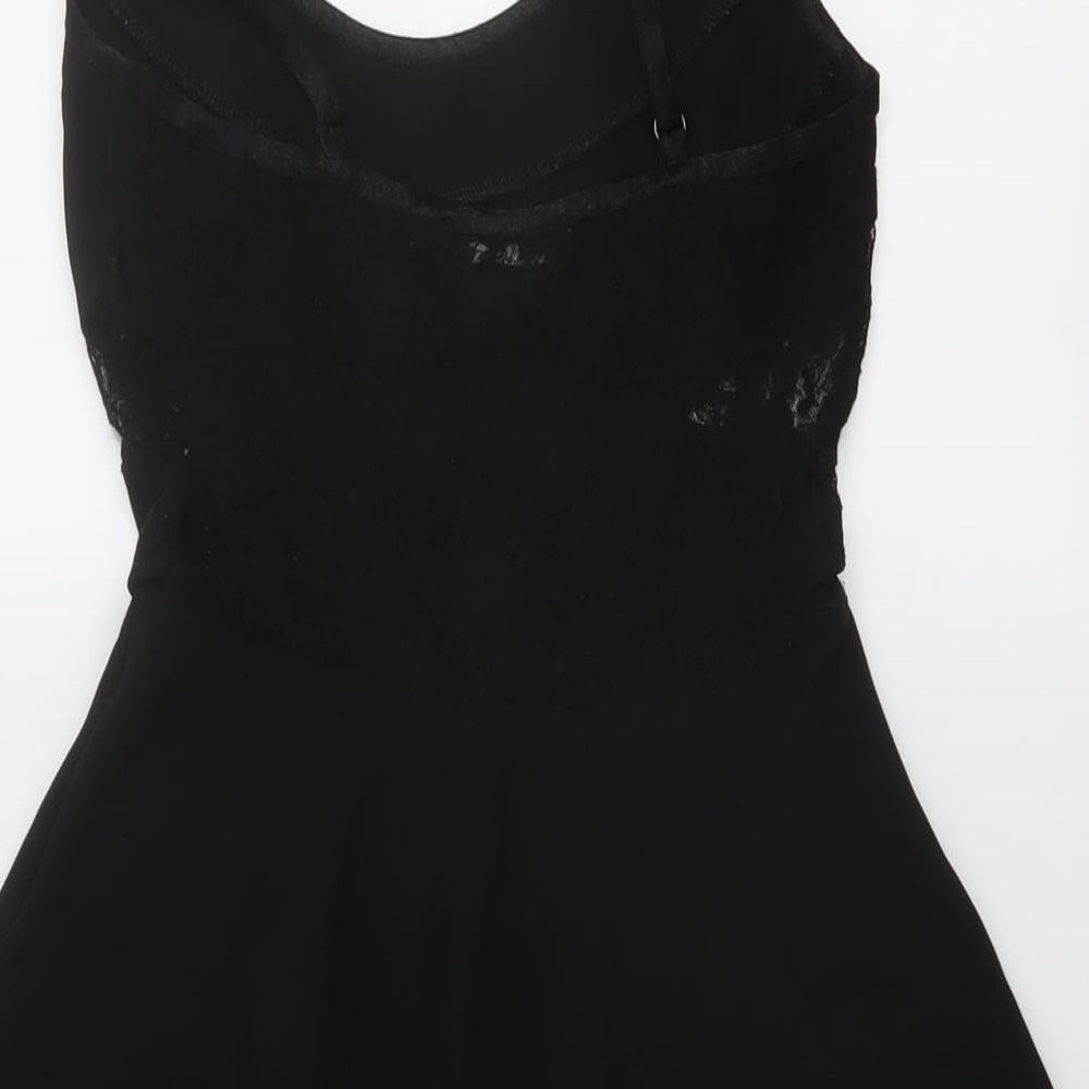 Brand and care label for Miss Selfridge women’s black polyester skater dress, size UK 6, round neck pullover