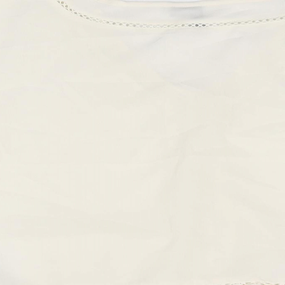 Brand and care label for ASOS women’s white polyester cropped blouse, size UK 8, v-neck