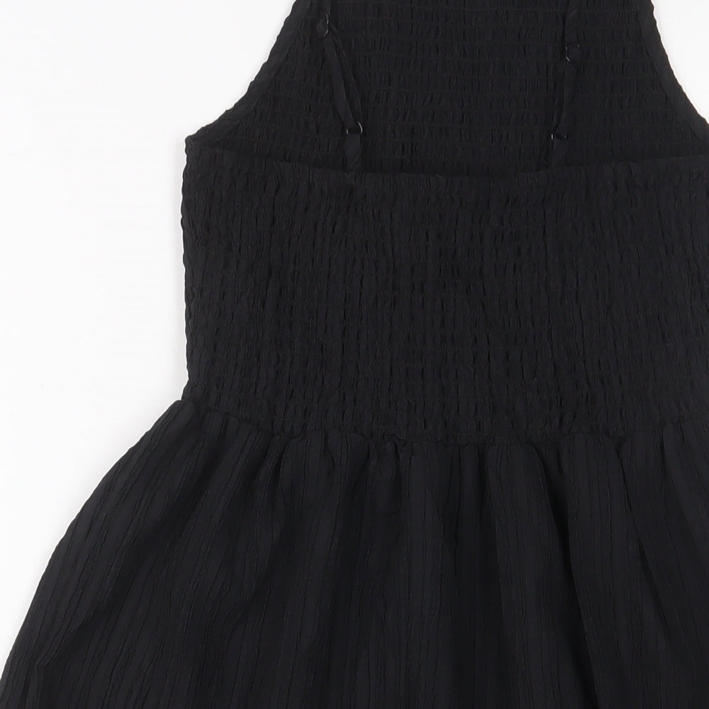 Brand and care label for ASOS women’s black polyester a-line, size UK 6, square neck pullover