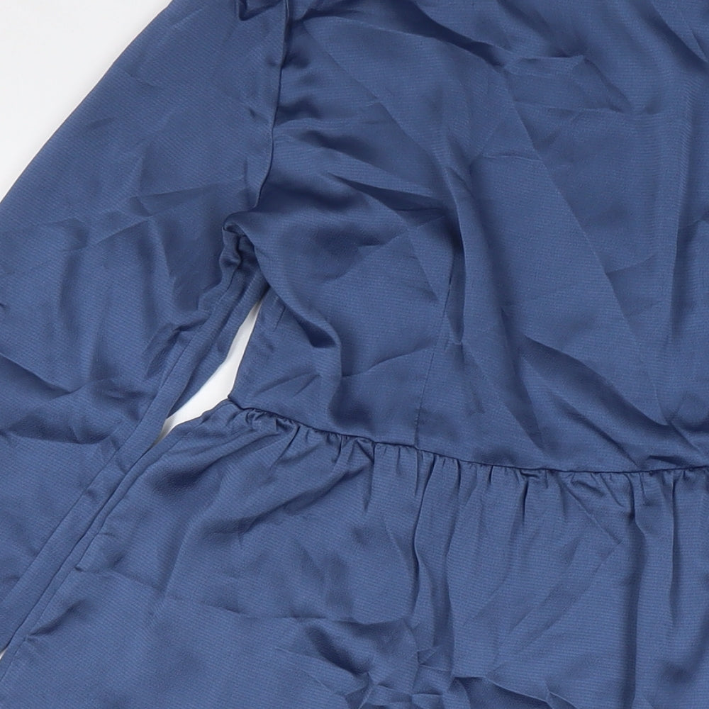 Brand and care label for Missguided women’s blue polyester shirt dress, size UK 12, collared button