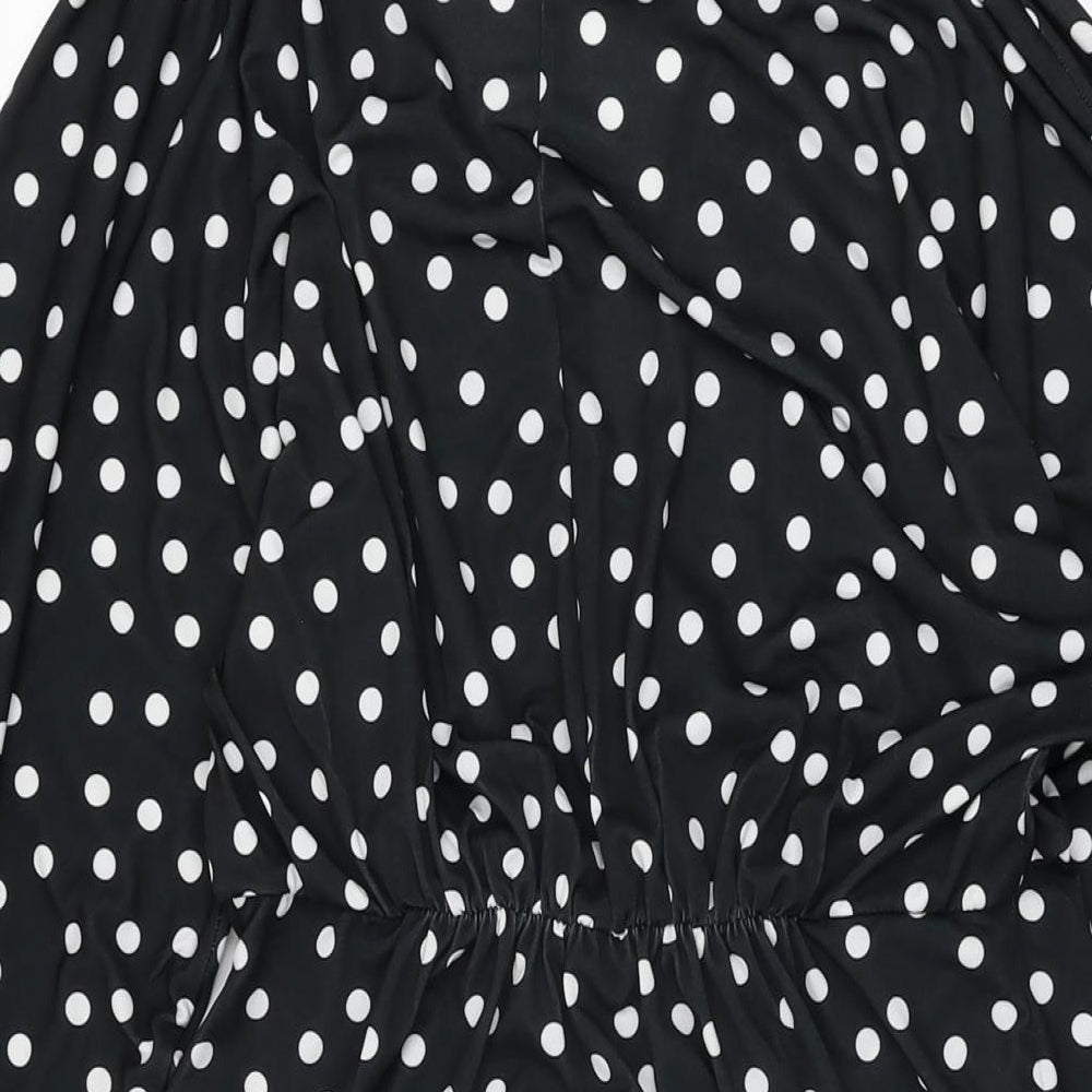 Brand and care label for ASOS women’s black polka dot polyester shift, size UK 12, v-neck pullover