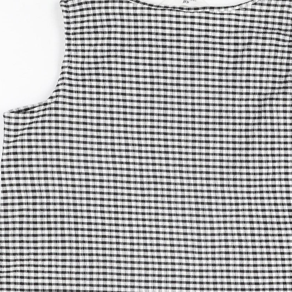 Brand and care label for H&M girls’ black gingham polyester basic t-shirt, size 11-12, years round neck pullover