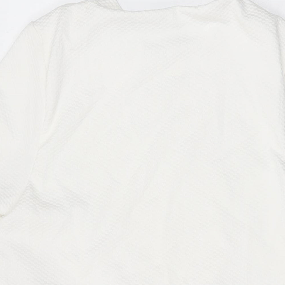 Brand and care label for ASOS women’s white polyester a-line, size UK 10, round neck pullover