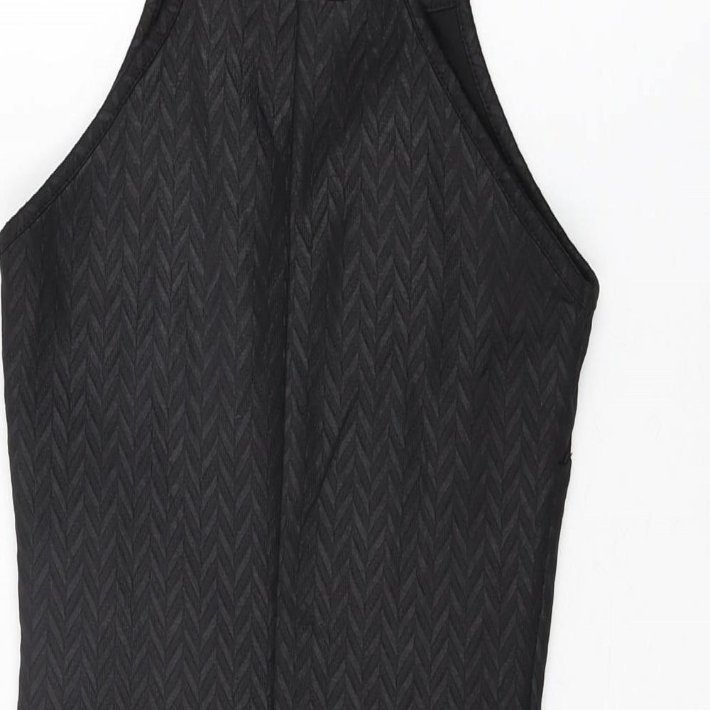 Brand and care label for Miss Selfridge women’s black polyester bodycon, size UK 4, round neck pullover