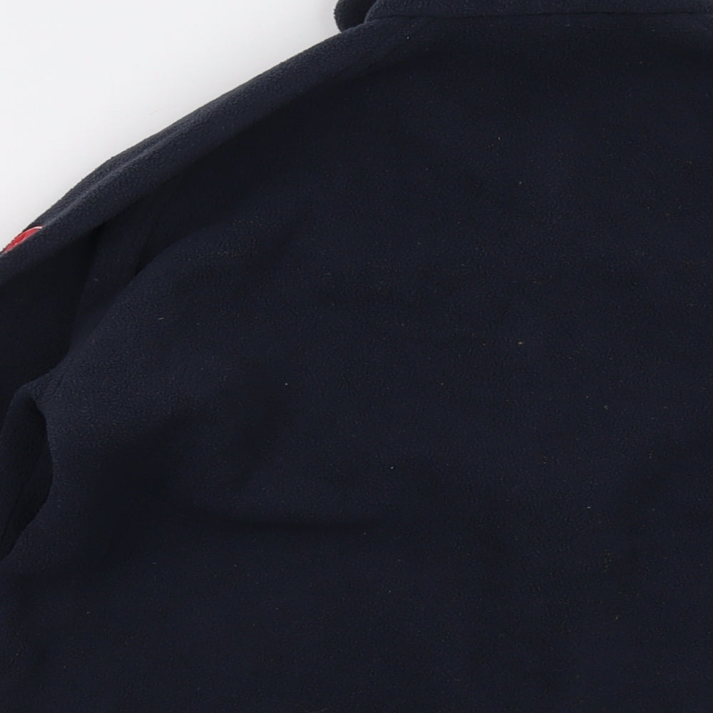Brand and care label for Tribord boys’ blue jacket, size 14, years zip