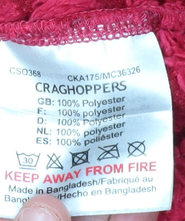 Brand and care label for Craghoppers girls’ red 1/4 zip jacket, age 13 years, polyester