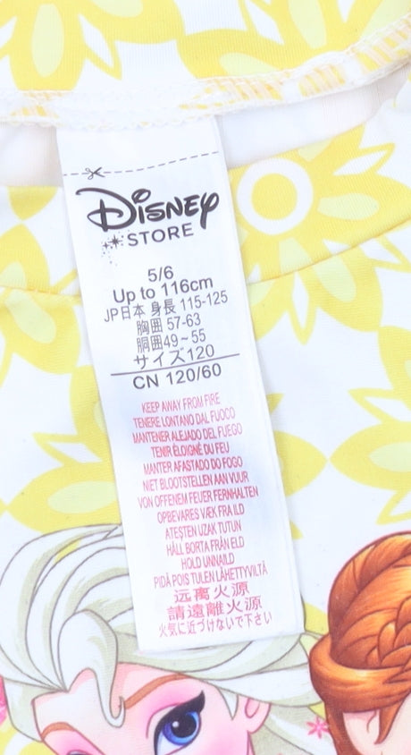 Brand and care label for Disney Frozen girls’ yellow rash guard 5-6 years floral