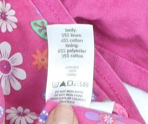 Brand and care label for Cherokee girls’ pink embroidered jacket 3-4 years
