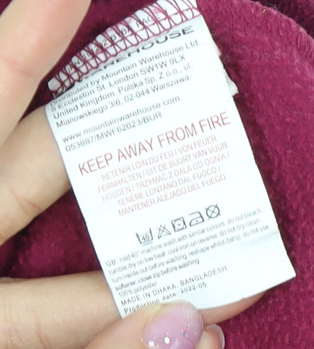 Brand and care label for Mountain Warehouse girls’ red fleece pullover 15-16 years