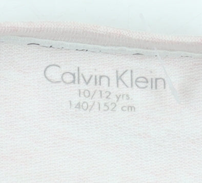 Brand and care label for Calvin Klein girls’ pink pullover sweatshirt 10-11 years
