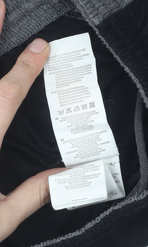 Brand and care label for Slazenger boys’ black track pants 9-10 years